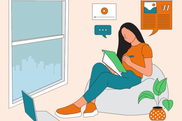 Woman sitting on a beanbag and writing