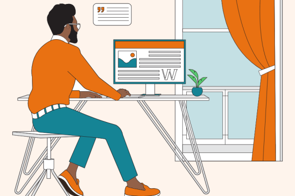 Male author using a PC at a desk by a window
