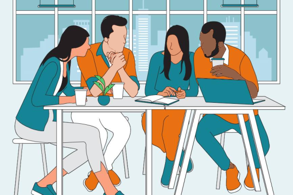 Four people collaborating around a table