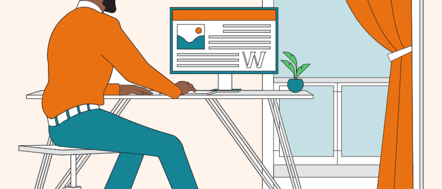 Male author using a PC at a desk by a window